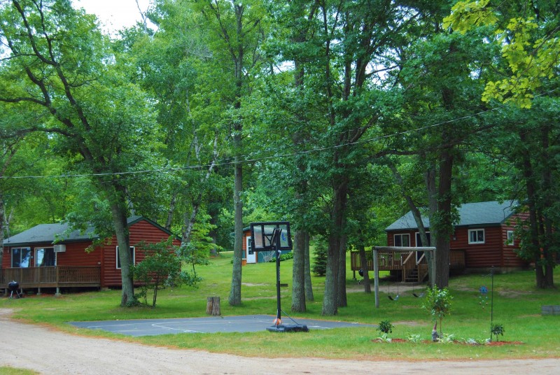 Red and Jack cabins and basketball hoop.