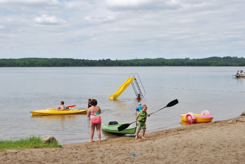 Kids on beach and in kayaks