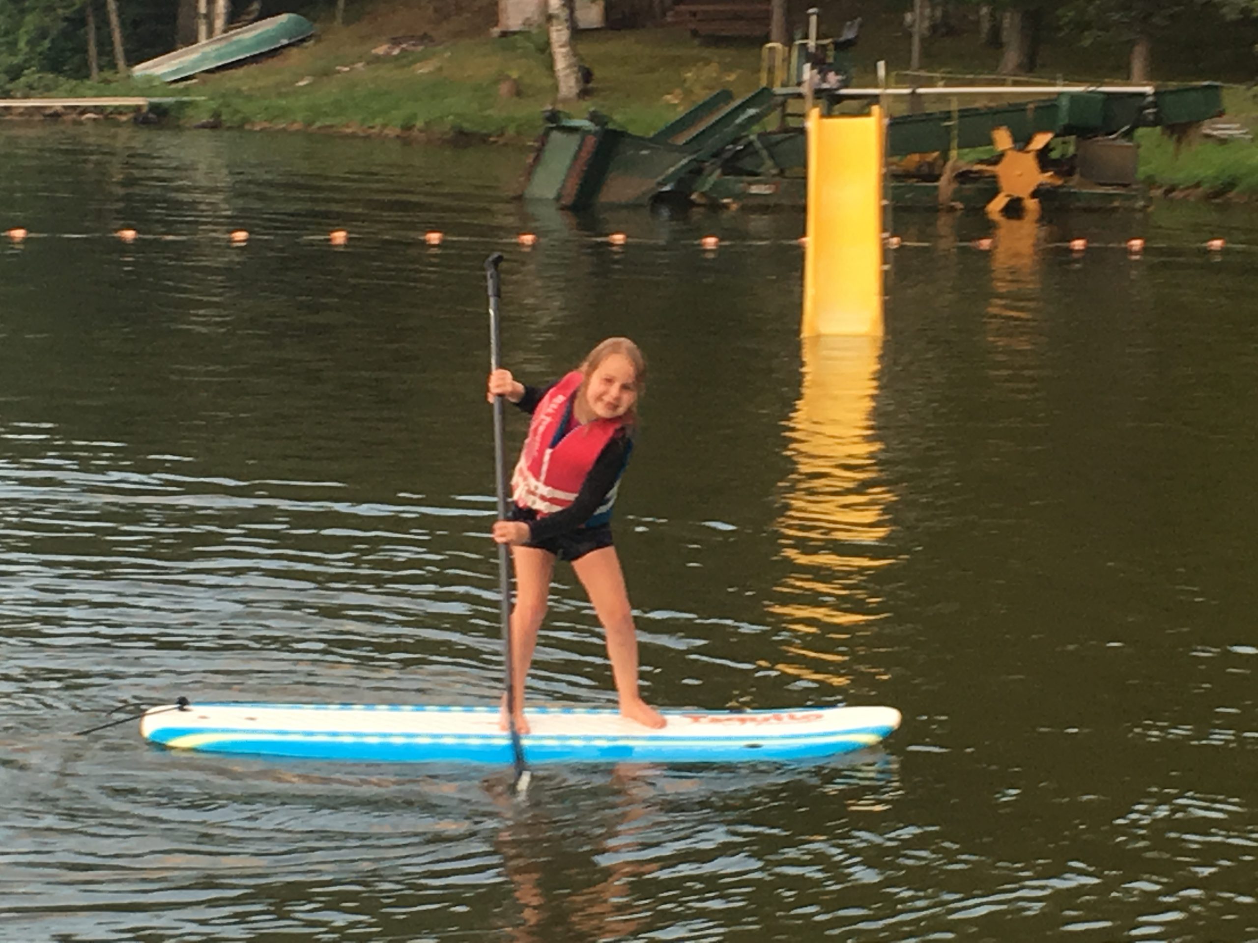 Young girl on stand up paddleboard.