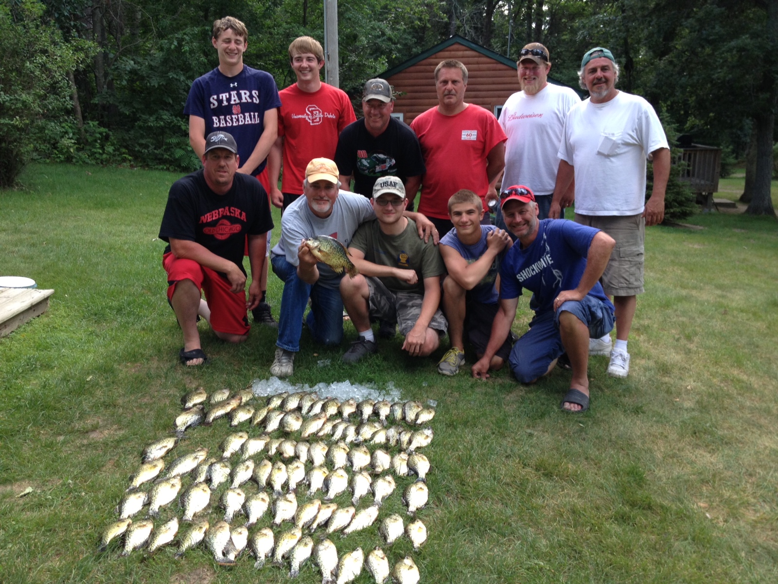 Group of guys posing with caught fish